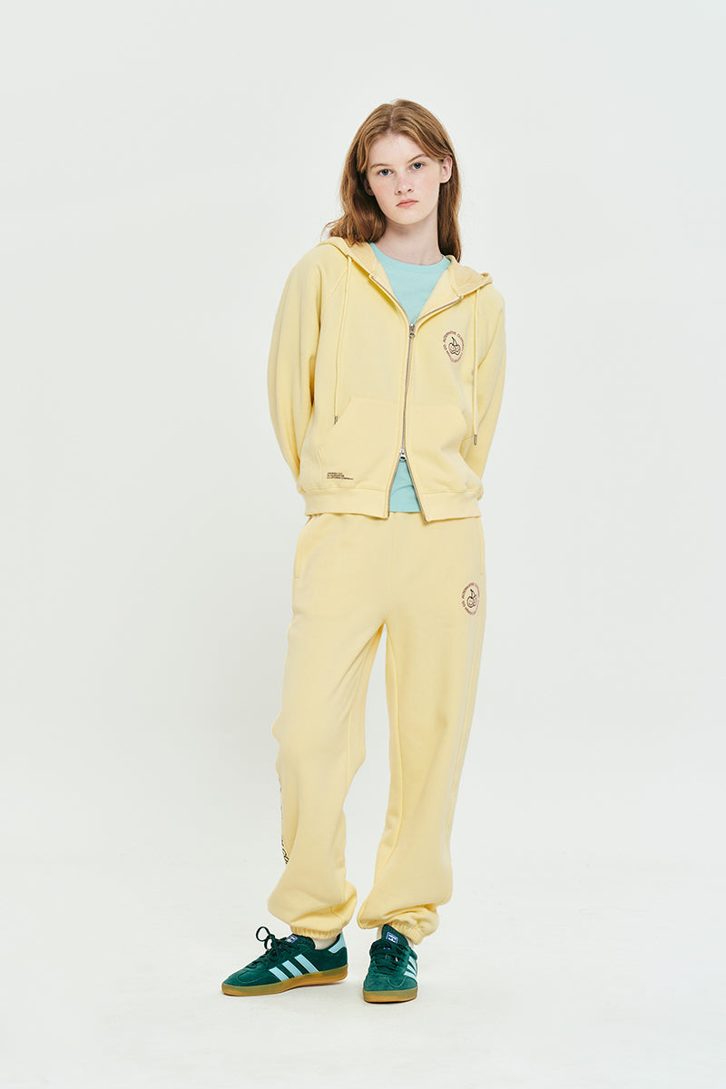 ドゥードゥルチェリーサークルロゴナッピングフーディージップジップアップ【ライトイエロー】