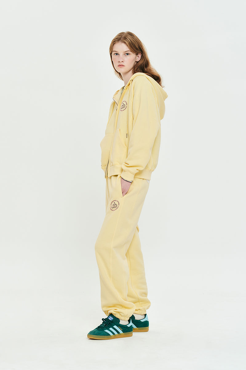 ドゥードゥルチェリーサークルロゴナッピングフーディージップジップアップ【ライトイエロー】