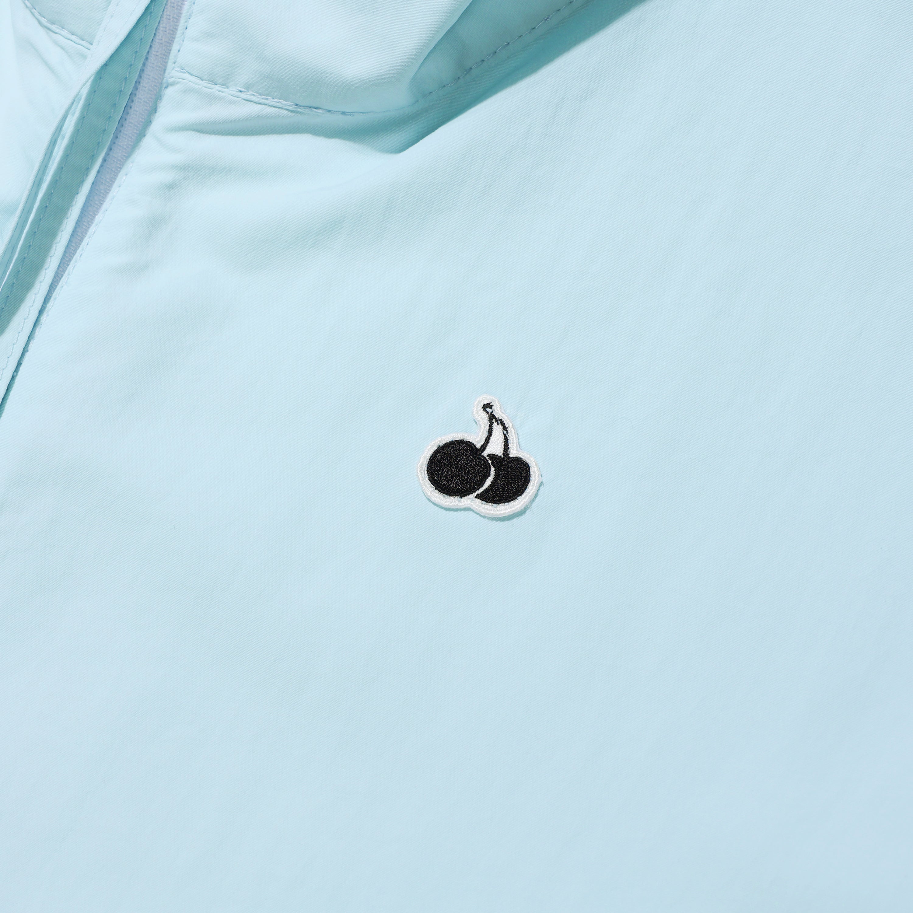 UNI モノチェリーハーフジップアップアノラック【アイス】